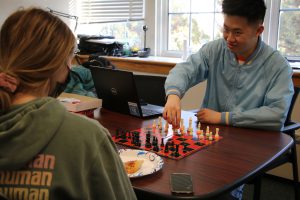 Students relax with a game of chess.