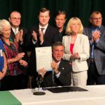 Governor John Carney signs bill at McKean High School in Wilmington