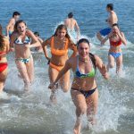 Polar Bear Plunge participants emerging from the water