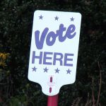 sign that says vote here