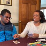 Malika Simmons and her son Eli, who has autism spectrum disorder and severe learning disabilities, work on a lesson together in their home.