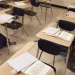 school desks in an empty classroom