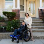 Kendra Mendoza stands slightly behind her son, Joshua, who has cerebral palsy and uses a wheelchair.