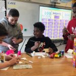 Students play a trivia game in a classroom in Postlethwait Middle School