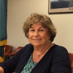Elaine Manlove, Delaware's former election commissioner, poses at a desk in her office