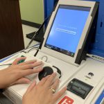 A voting machine with accessibility features for those with vision impairments