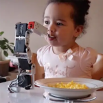 Child using a custom-designed device to help with physical disabilities