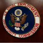 The shield of the U.S. Equal Employment Opportunity Commission on the front of a podium.