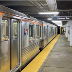 A silver SEPTA train sits at an underground station.