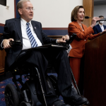 Rep. Jim Langevin and House Speaker Nancy Pelosi at a July celebration of the Americans With Disabilities Act. Langevin uses a powerchair.