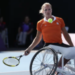 Esther Vergeer returns to Netherlands' Jiske Griffioen, not seen, during the women's single wheelchair tennis semifinal match at the 2012 Paralympics