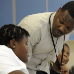 Timothy Allison, a collaborative special education teacher in Birmingham, Ala., works with a student