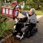 Katherine Vaczi, a retired teacher, picks up her mail — from the schoolhouse mailbox — at her home in Gloucester County.