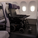 Prototype of an airplane seat folded to make room for a power wheelchair