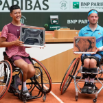 Tokito Oda and Alfie Hewett in wheelchairs on the clay court of the French Open, holding their silver platters.